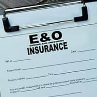 Close up of a clipboard with a blank Errors and Omissions Insurance form