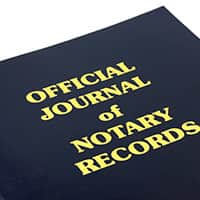 An image of a official notary journal with a blue cover and gold lettering